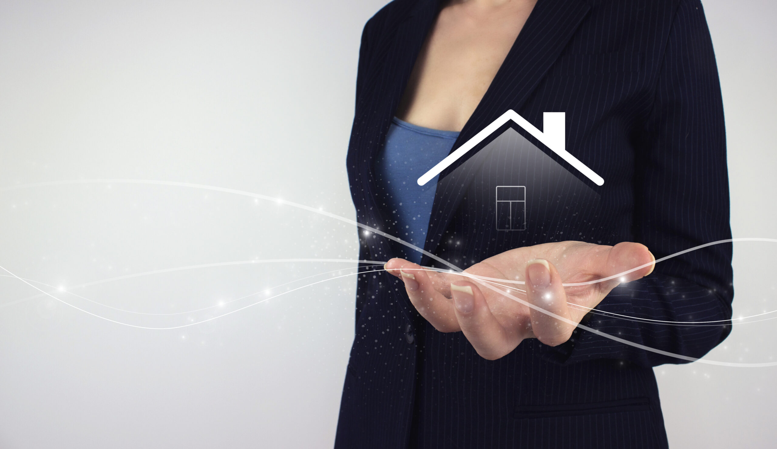 Businesswoman displaying a virtual house icon, representing the fast adoption of Esignature for Real Estate supported by an easy electronic signature app.