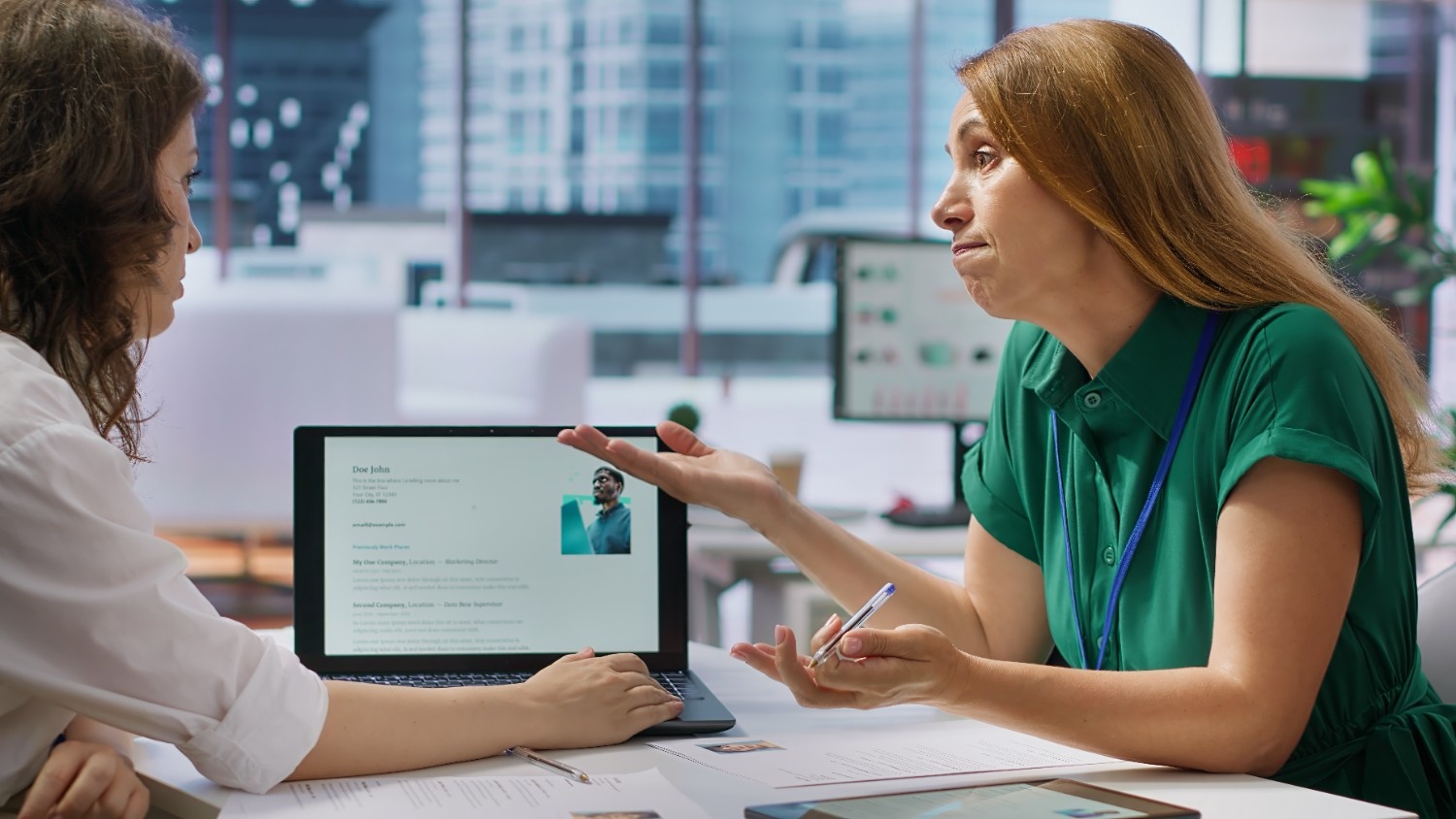 HR manager using an electronic signature app for HR onboarding with a secure digital signature app for HR onboarding on a laptop.