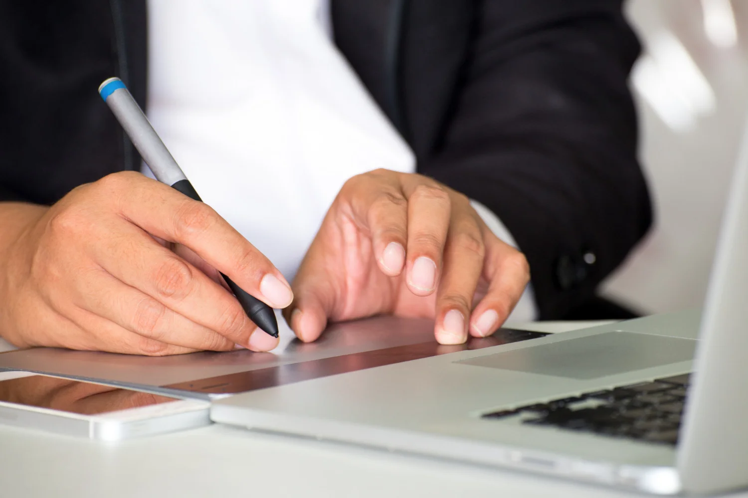 Insurance professional reviewing claims digitally using an eSignature app to accelerate processing.