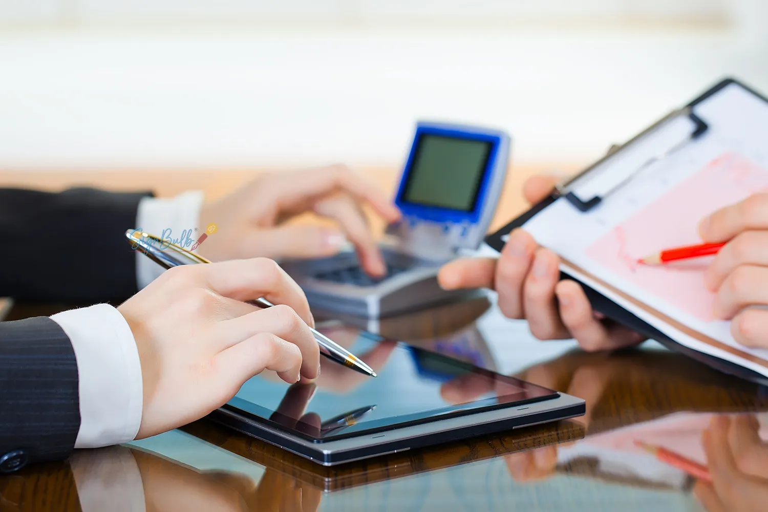 Business professionals using an electronic signature app to sign documents digitally with a custom eSignature for financial agreements review.